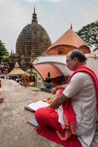 A Hindu priest reading scriptures at the Kamakhya Temple in Guwahati, Assam, India.