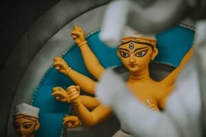 Close-up of a traditional Durga idol depicting the goddess's multiple hands in Kolkata, India.